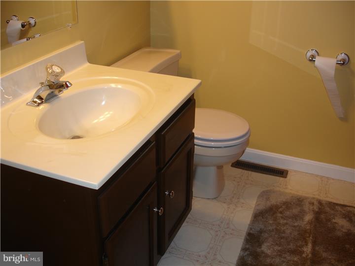 696 Guernsey Road South Landenberg, PA 19350 - Photo 21 of 25 a bathroom with a sink and a toilet