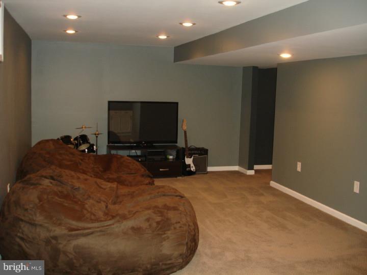 696 Guernsey Road South Landenberg, PA 19350 - Photo 24 of 25 a room with a bed and a flat screen tv