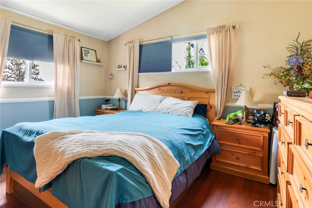 9579 Hampshire Street Rancho Cucamonga, CA 91730 - Photo 15 of 25 a bedroom with bed and wooden floor