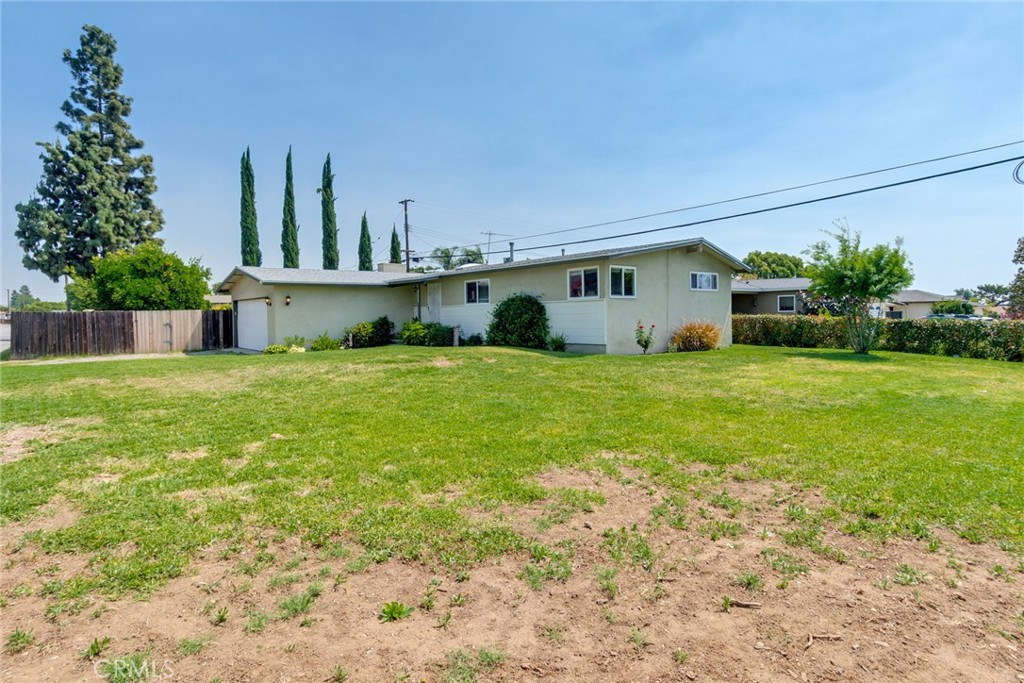 9579 Hampshire Street Rancho Cucamonga, CA 91730 - Photo 2 of 25 a view of a house with a yard and plants