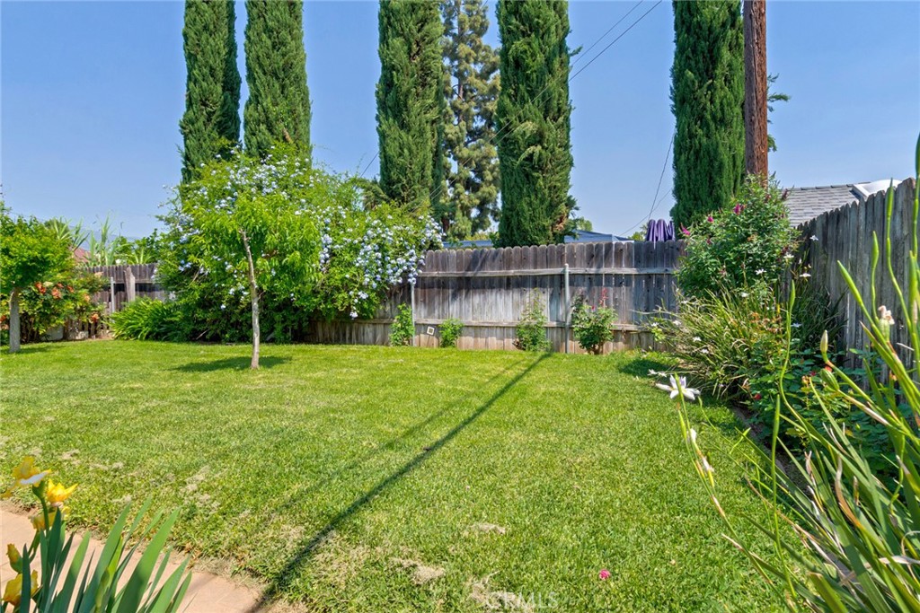 9579 Hampshire Street Rancho Cucamonga, CA 91730 - Photo 21 of 25 a view of a house with a backyard