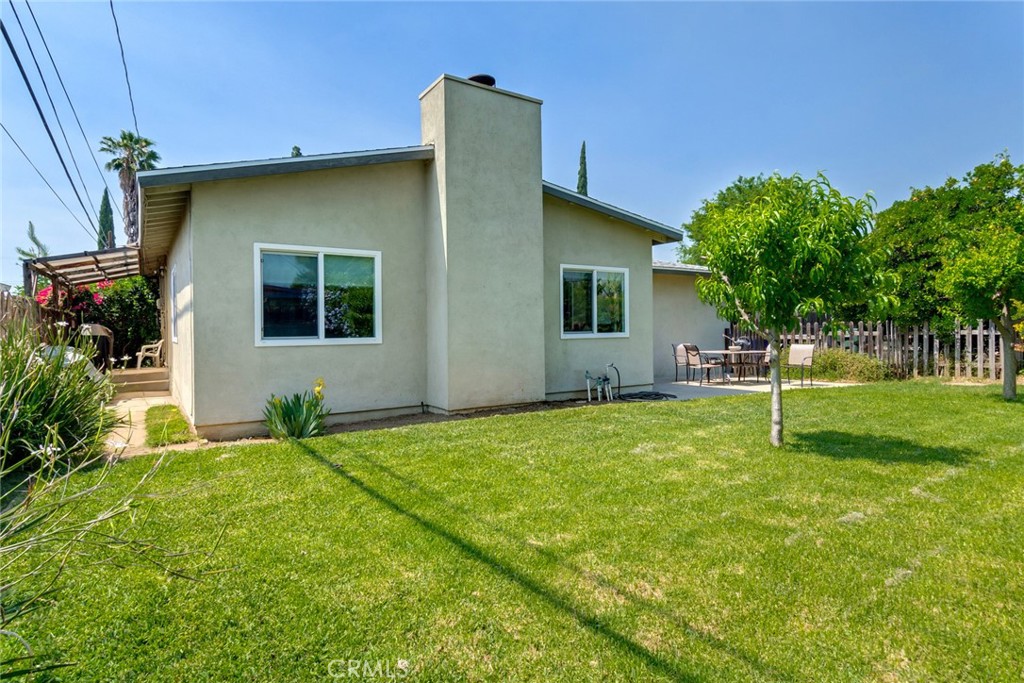 9579 Hampshire Street Rancho Cucamonga, CA 91730 - Photo 22 of 25 a house with a tree in front of it