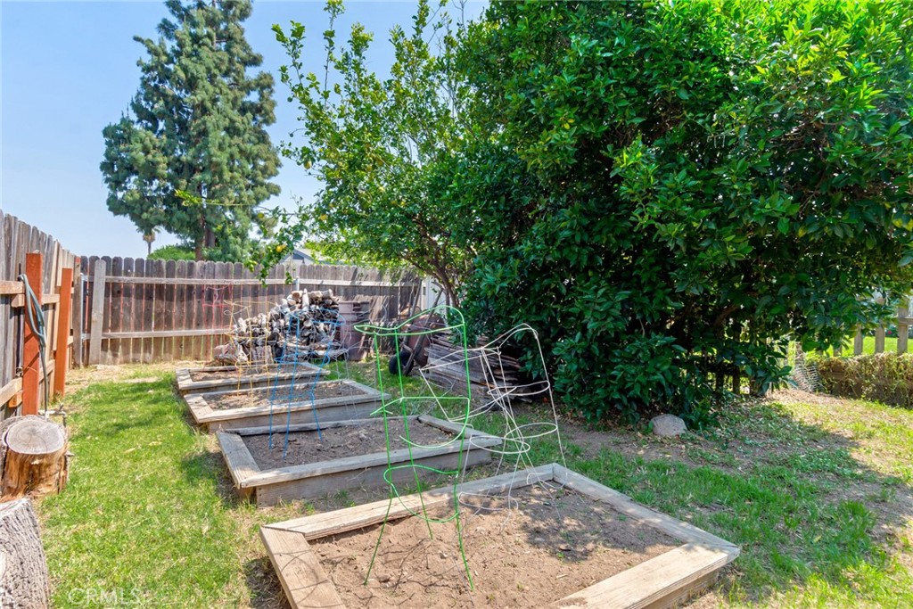 9579 Hampshire Street Rancho Cucamonga, CA 91730 - Photo 25 of 25 a view of a backyard with couches chair and grass