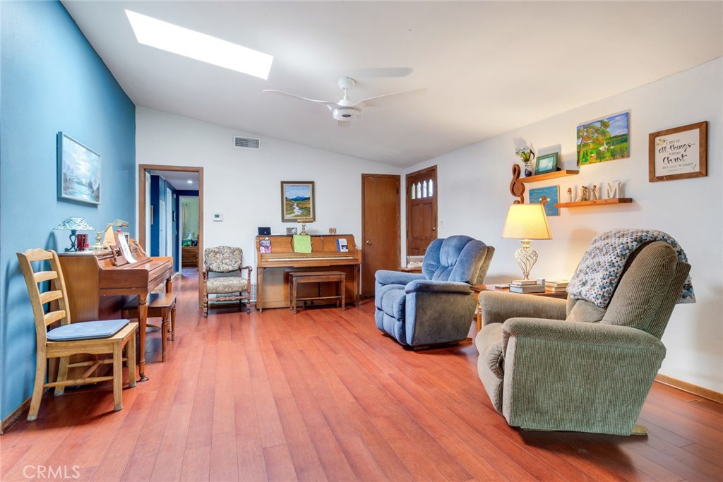 9579 Hampshire Street Rancho Cucamonga, CA 91730 - Photo 3 of 25 a living room with furniture and a wooden floor