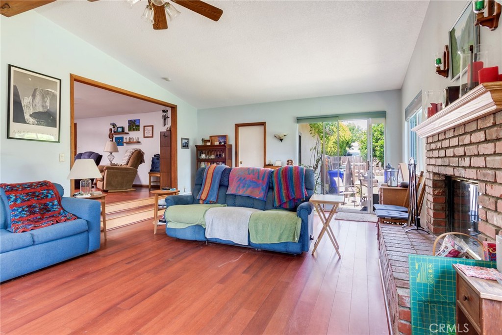 9579 Hampshire Street Rancho Cucamonga, CA 91730 - Photo 6 of 25 a living room with furniture and a fireplace