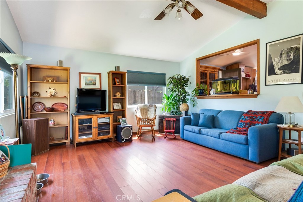 9579 Hampshire Street Rancho Cucamonga, CA 91730 - Photo 7 of 25 a living room with furniture and a flat screen tv