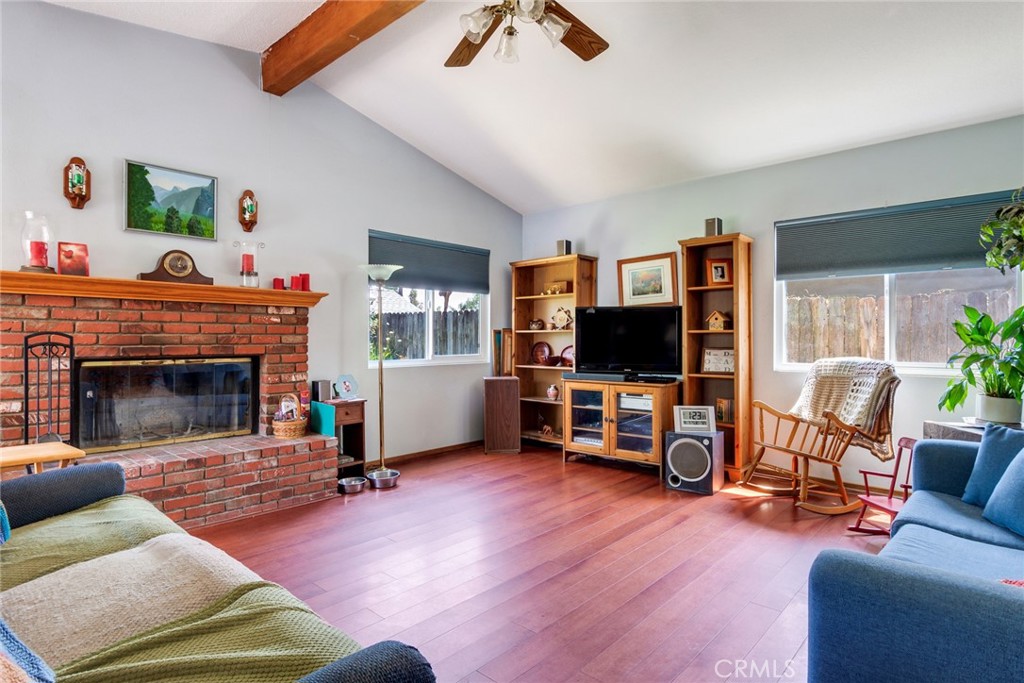 9579 Hampshire Street Rancho Cucamonga, CA 91730 - Photo 8 of 25 a living room with furniture and a flat screen tv