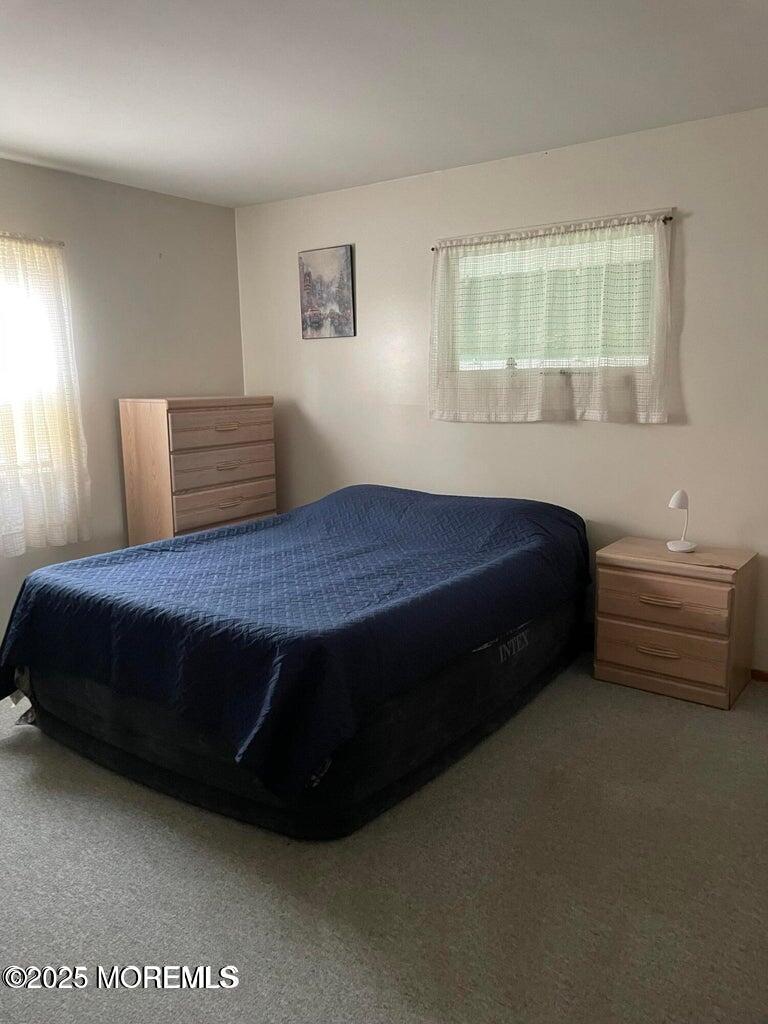 7 Walnut Street, Unit C Toms River, NJ 08757 - Photo 18 of 28 a bedroom with a bed and window