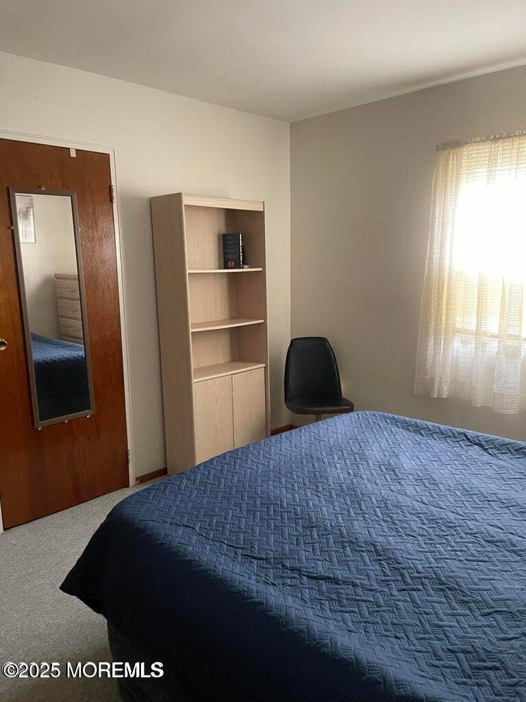 7 Walnut Street, Unit C Toms River, NJ 08757 - Photo 19 of 28 a bedroom with a bed and a window