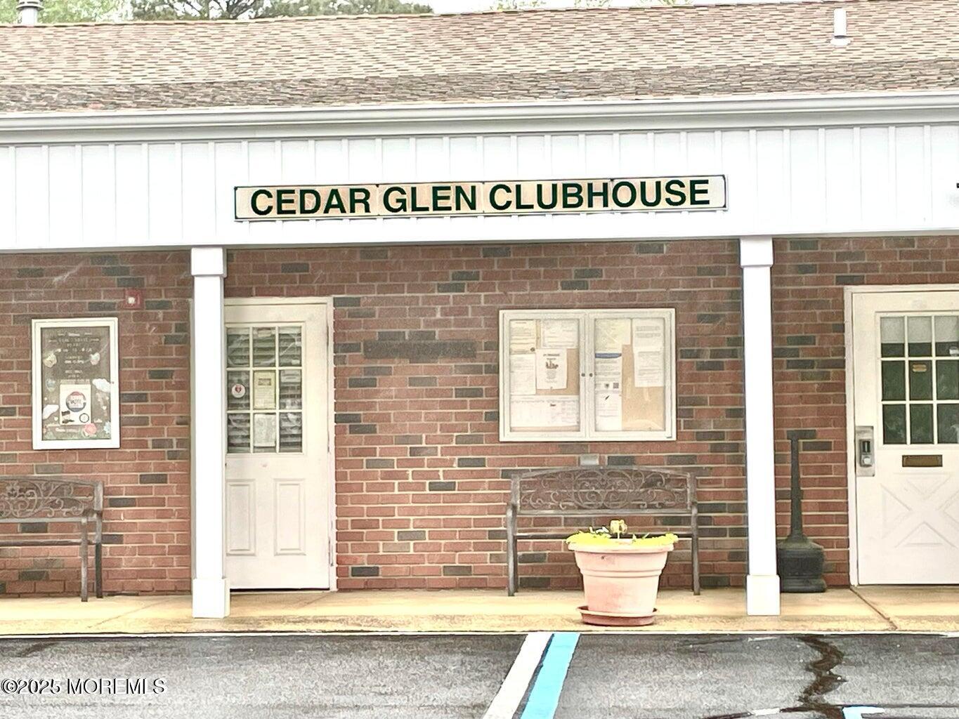 7 Walnut Street, Unit C Toms River, NJ 08757 - Photo 22 of 28 a front view of a building with a couple of cars parked