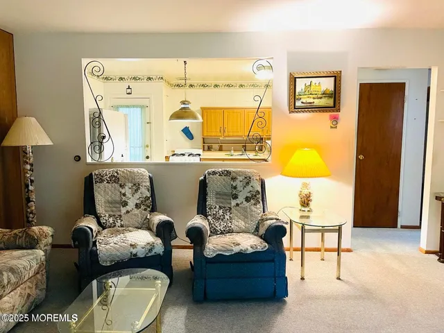 a living room with furniture and a table