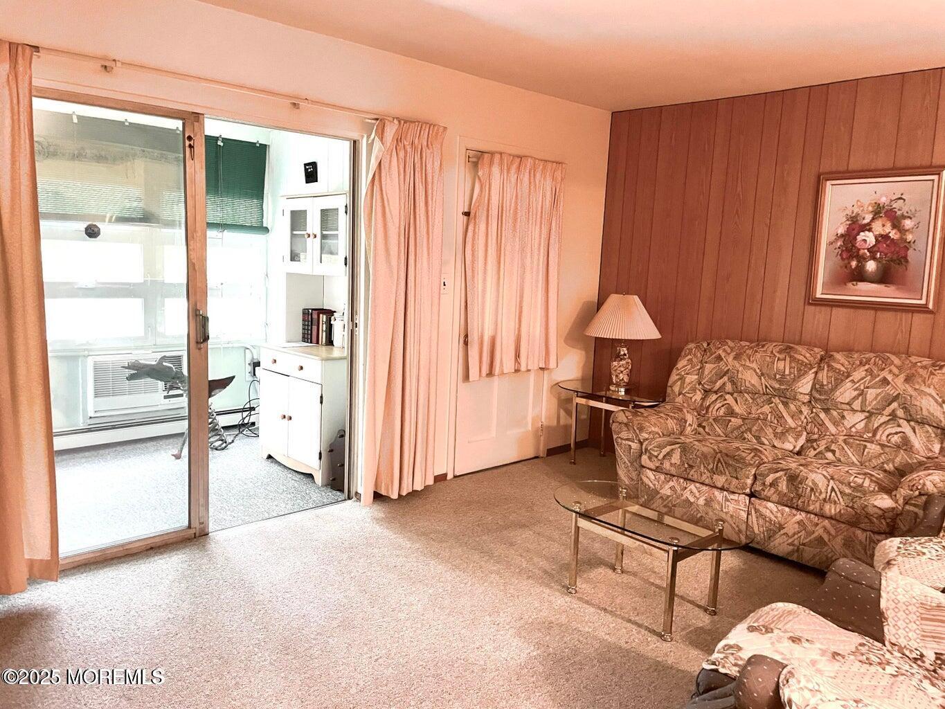 7 Walnut Street, Unit C Toms River, NJ 08757 - Photo 6 of 28 a living room with furniture and a large window