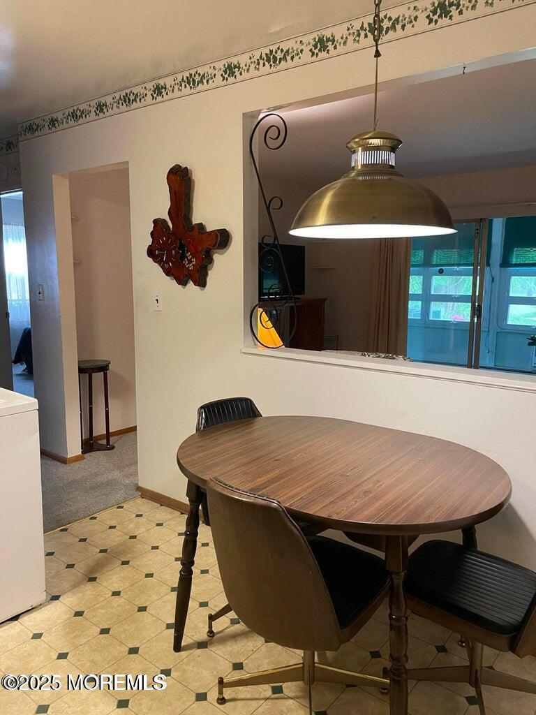 7 Walnut Street, Unit C Toms River, NJ 08757 - Photo 7 of 28 a kitchen with a table and chairs