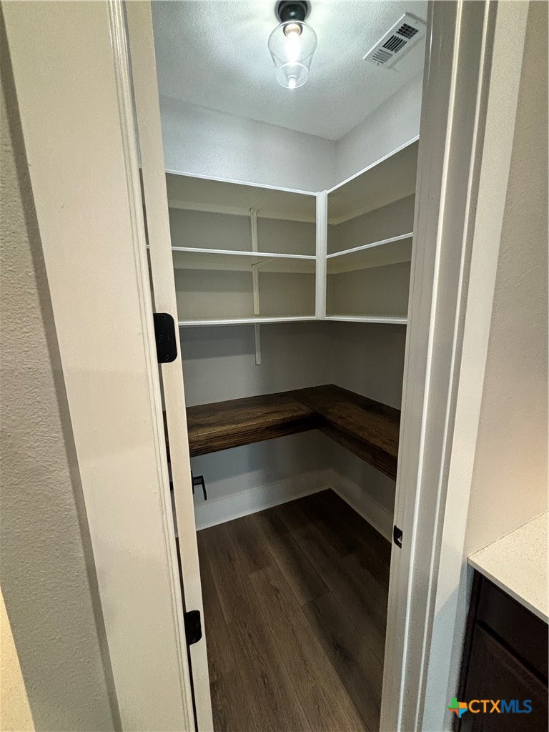 110 Hiram Cook Blanco, TX 78606 - Photo 28 of 46 a storage room with wooden floor