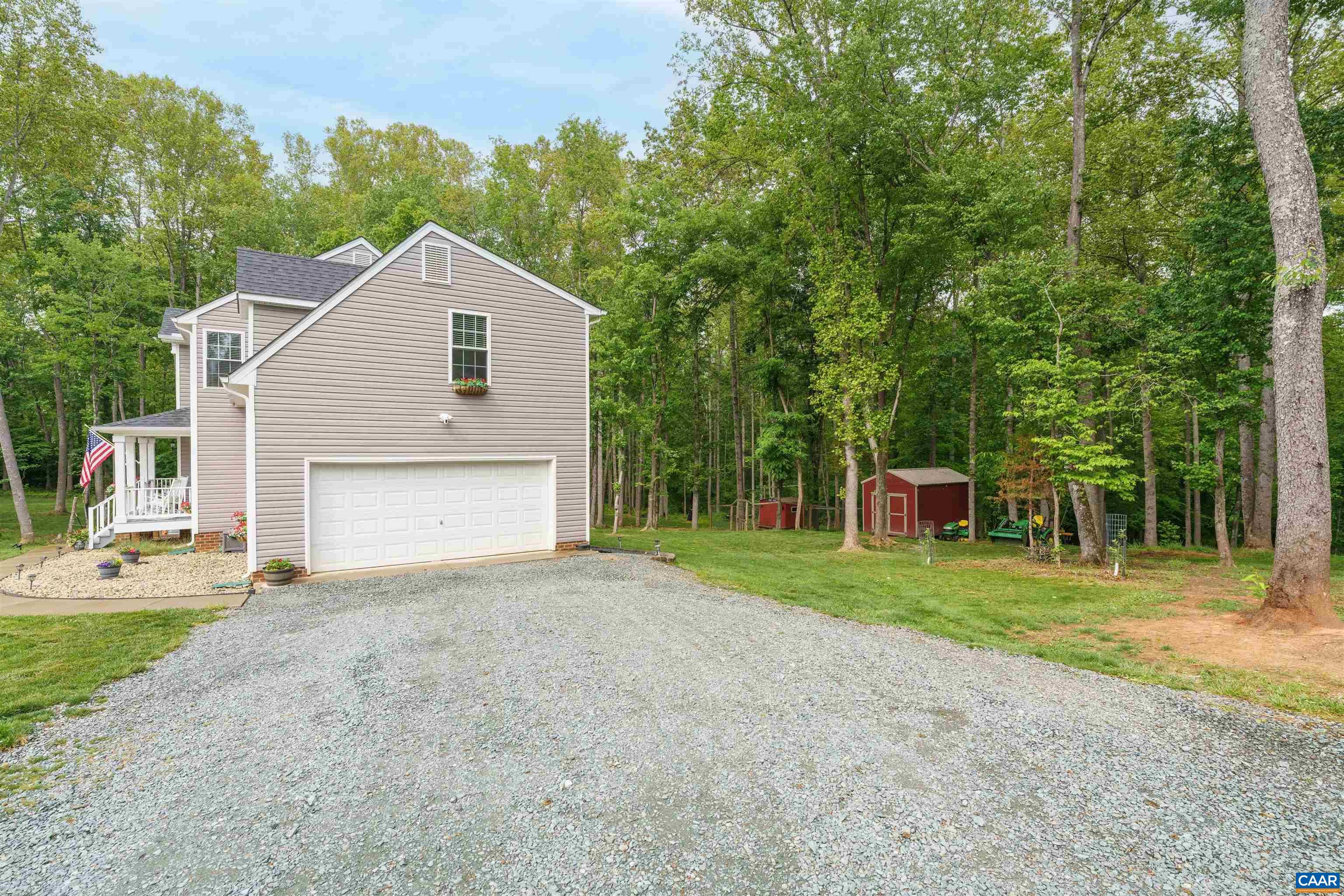 1760 Haden Martin Road Palmyra, VA 22963 - Photo 43 of 51 a front view of a house with a yard and trees