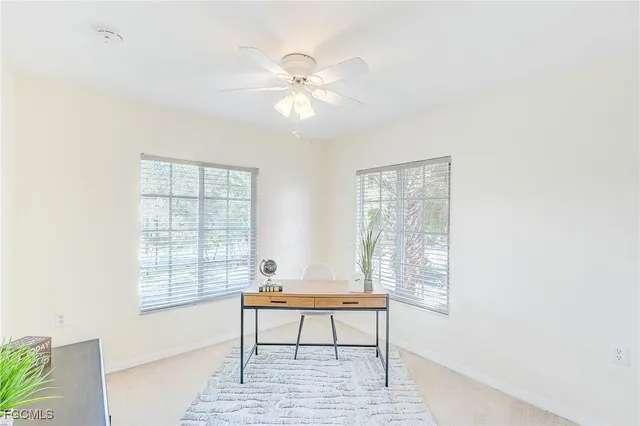 a view of a room with a window and wooden floor