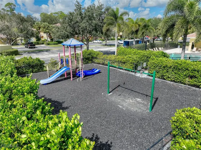 a view of a park with large trees