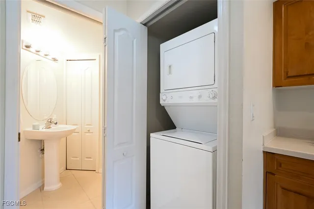 a view of bathroom with a sink and mirror