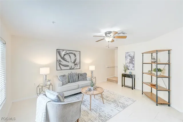 a living room with furniture and a table