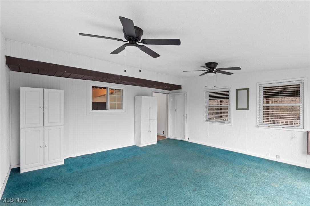 54885 Mt Victory Road Powhatan Point, OH 43942 - Photo 12 of 32 Empty room with carpet and ceiling fan