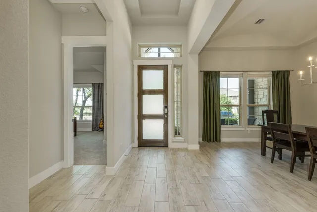 a view of a livingroom with furniture and front door