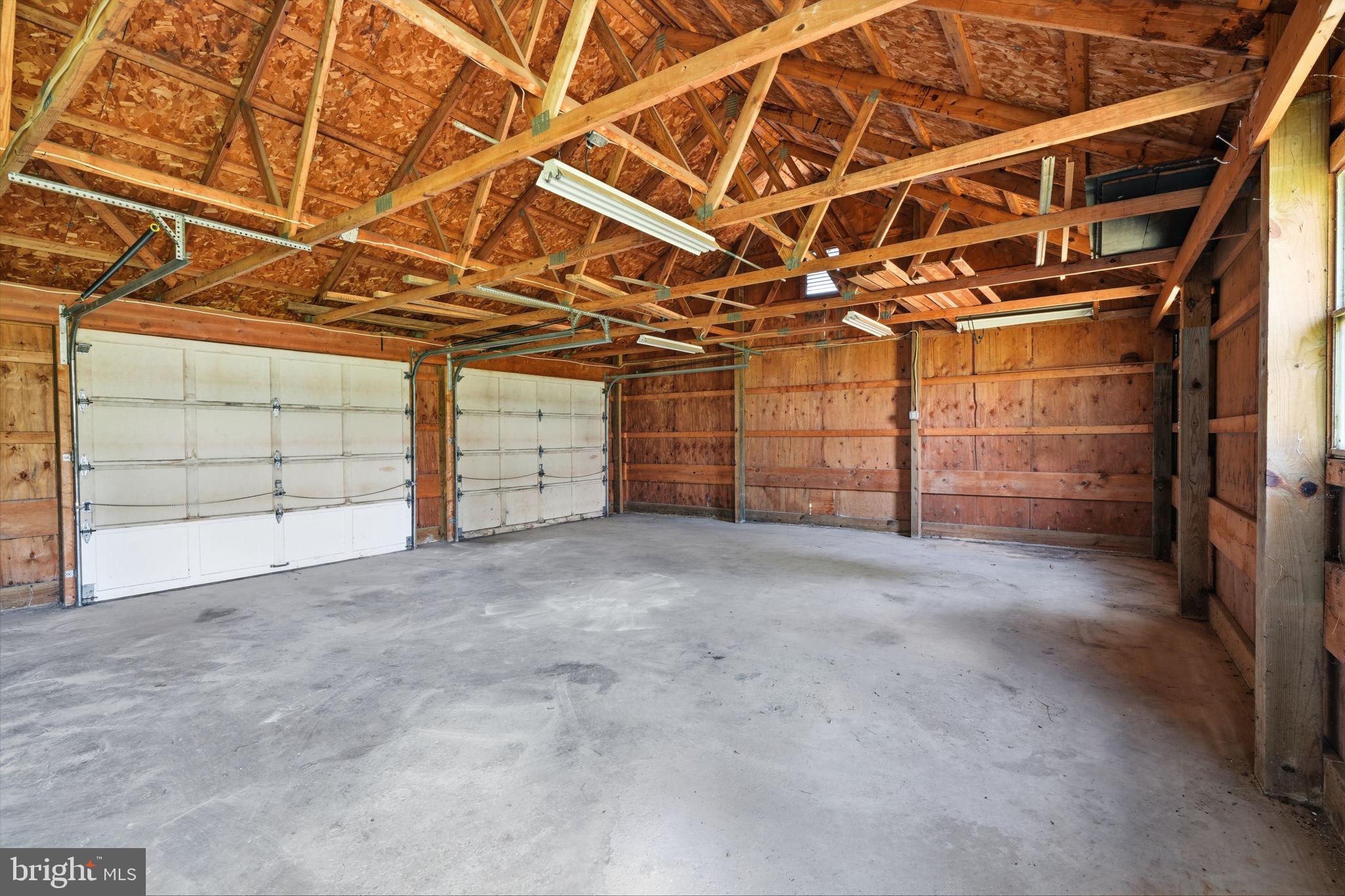 124 Cedar Road Riegelsville, PA 18077 - Photo 46 of 50 Spacious garage with rustic charm.