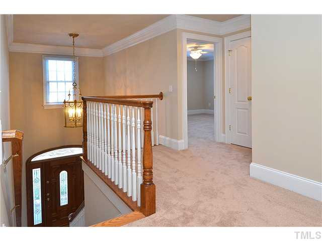 8311 Cazavini Court Raleigh, NC 27613 - Photo 17 of 22 a view of a hallway with windows