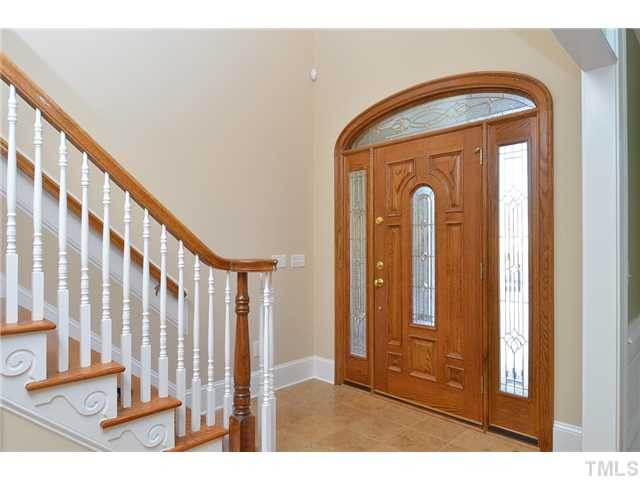8311 Cazavini Court Raleigh, NC 27613 - Photo 2 of 22 a view of front door with stairs
