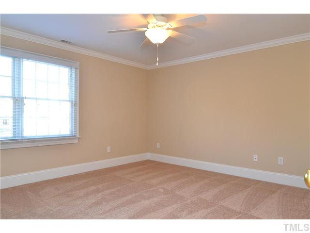 8311 Cazavini Court Raleigh, NC 27613 - Photo 21 of 22 a view of an empty room with a window