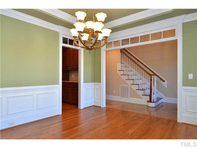 8311 Cazavini Court Raleigh, NC 27613 - Photo 4 of 22 a view of an entryway with wooden floor