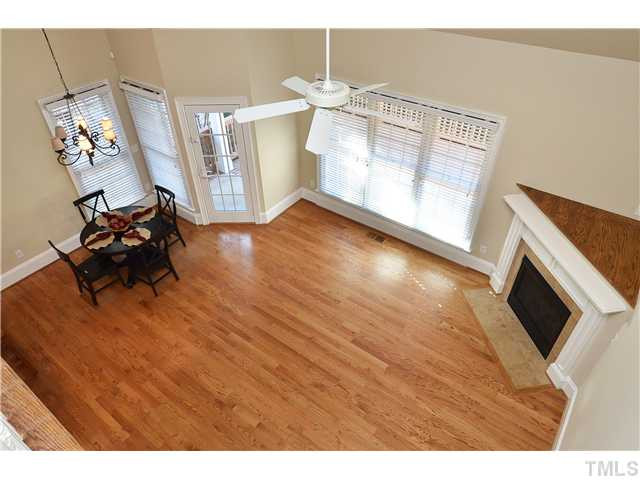 8311 Cazavini Court Raleigh, NC 27613 - Photo 10 of 22 a view of a livingroom with furniture hardwood floor and a ceiling fan