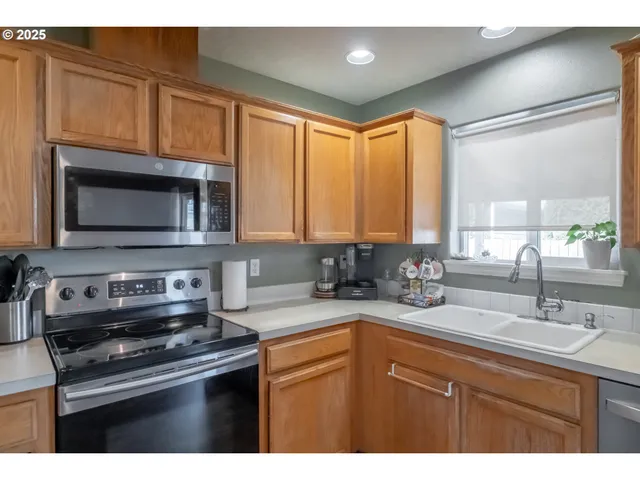 a kitchen with a table and chairs in it