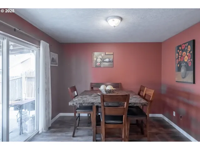 a bathroom with a sink a toilet and a shower curtain