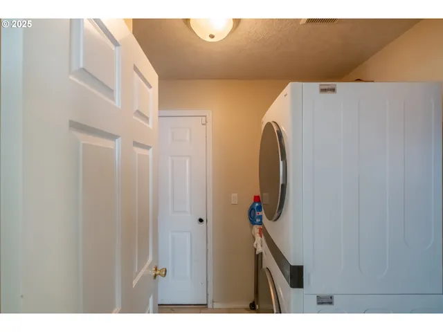 a view of a house with backyard porch and sitting area