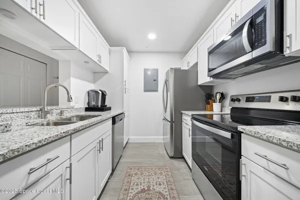 a view of front door and porch with wooden floor