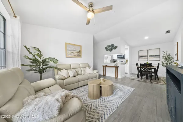 a bed room with a bed and a chandelier