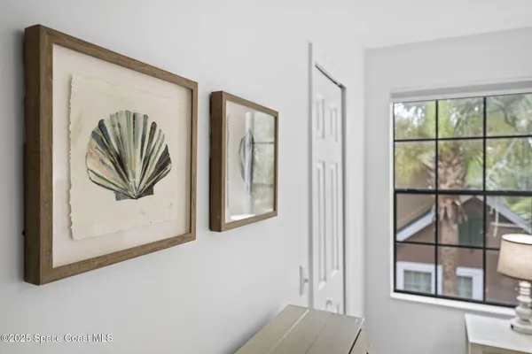 a bedroom with a bed dresser and a window