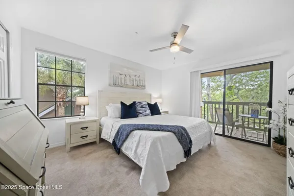 a bathroom with a double vanity sink toilet mirror and shower