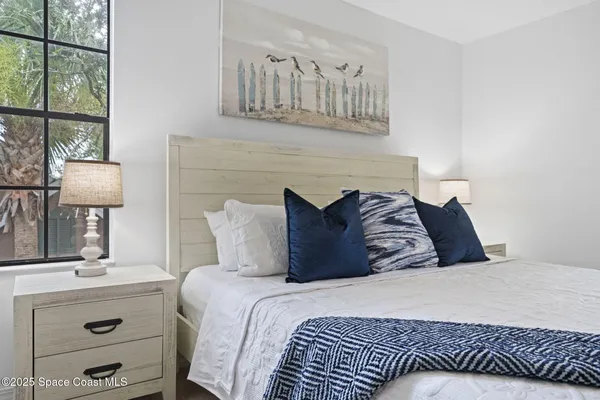 a view of a two chairs in the balcony