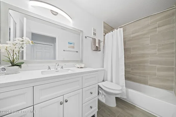 a balcony with table and chairs