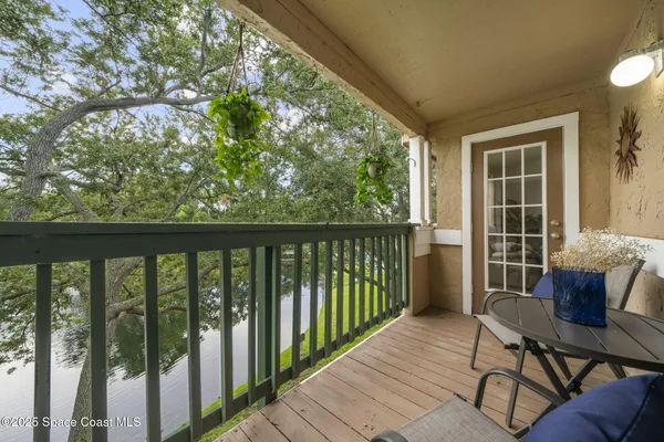 a view of a balcony with wooden floor