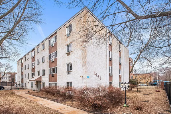 a view of a building with a yard