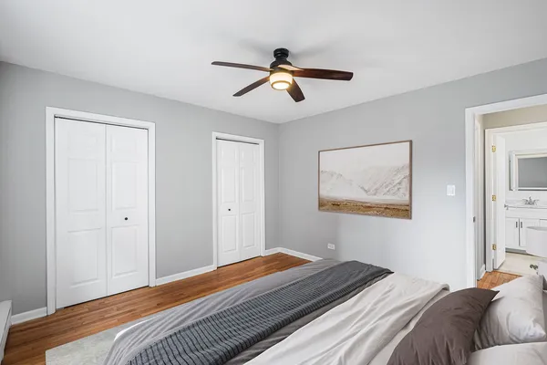 a bedroom with bed and window
