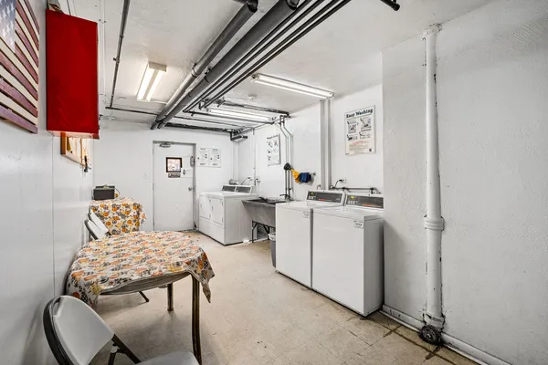 a kitchen with a sink cabinets and appliances