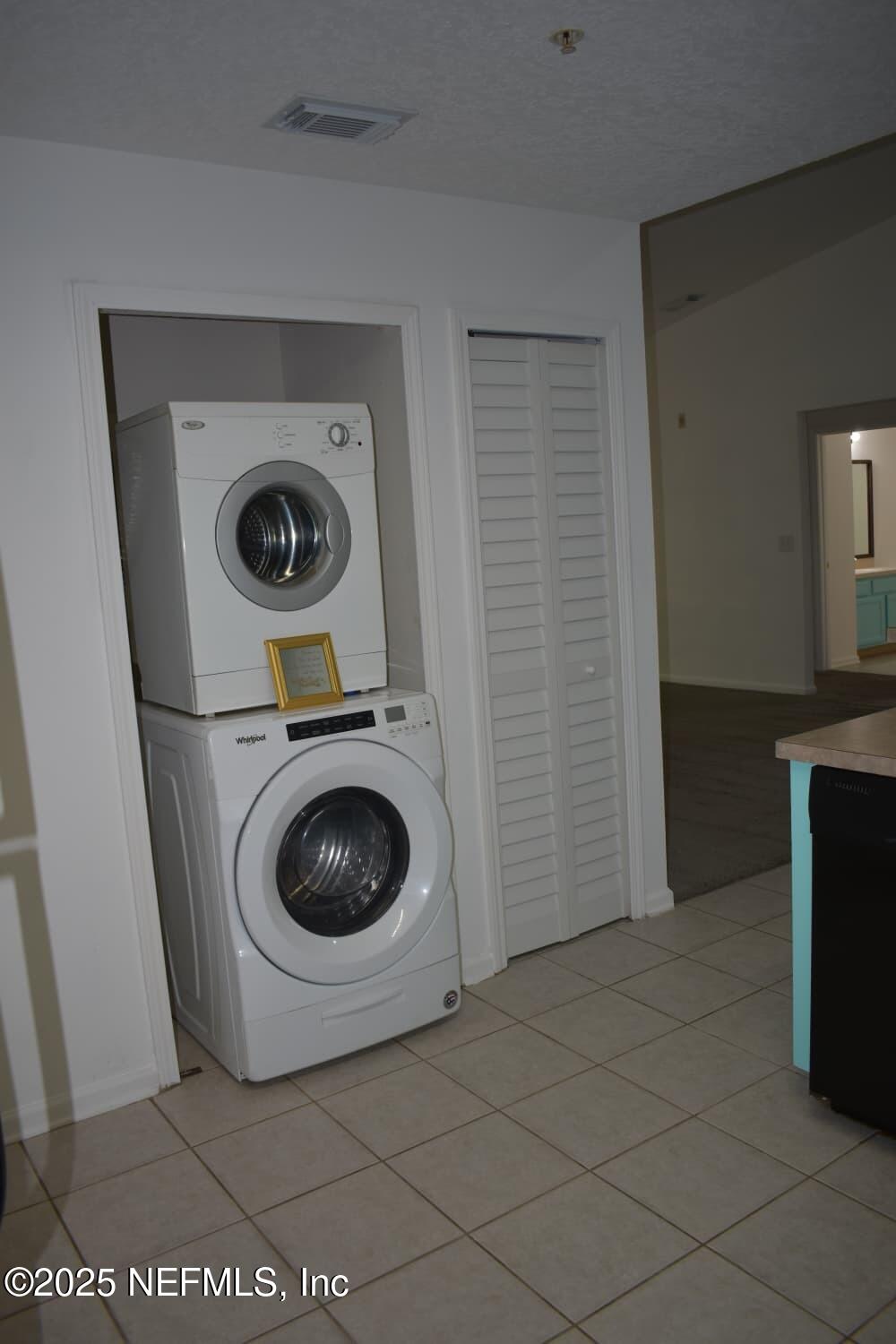 7920 Merrill Road, Unit 1710 Jacksonville, FL 32277 - Photo 17 of 51 a utility room with dryer and washer