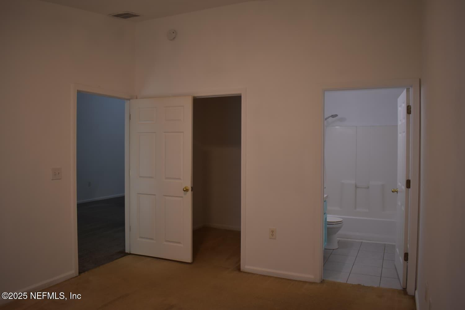 7920 Merrill Road, Unit 1710 Jacksonville, FL 32277 - Photo 19 of 51 an empty room with closet