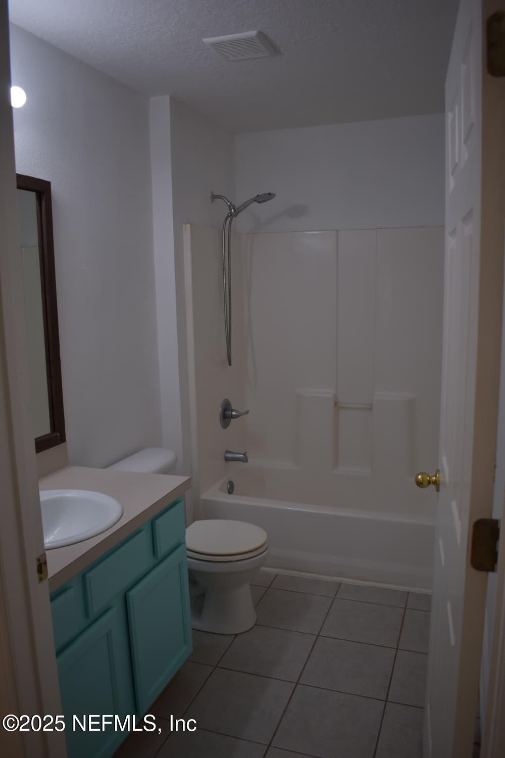 7920 Merrill Road, Unit 1710 Jacksonville, FL 32277 - Photo 21 of 51 a bathroom with a sink a toilet and shower