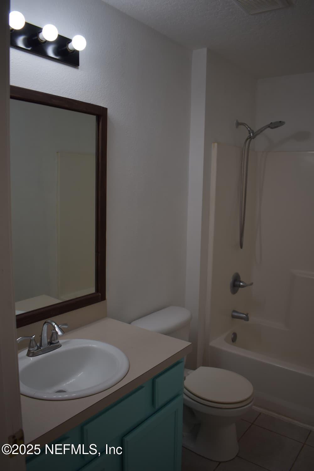 7920 Merrill Road, Unit 1710 Jacksonville, FL 32277 - Photo 23 of 51 a bathroom with a sink toilet and shower
