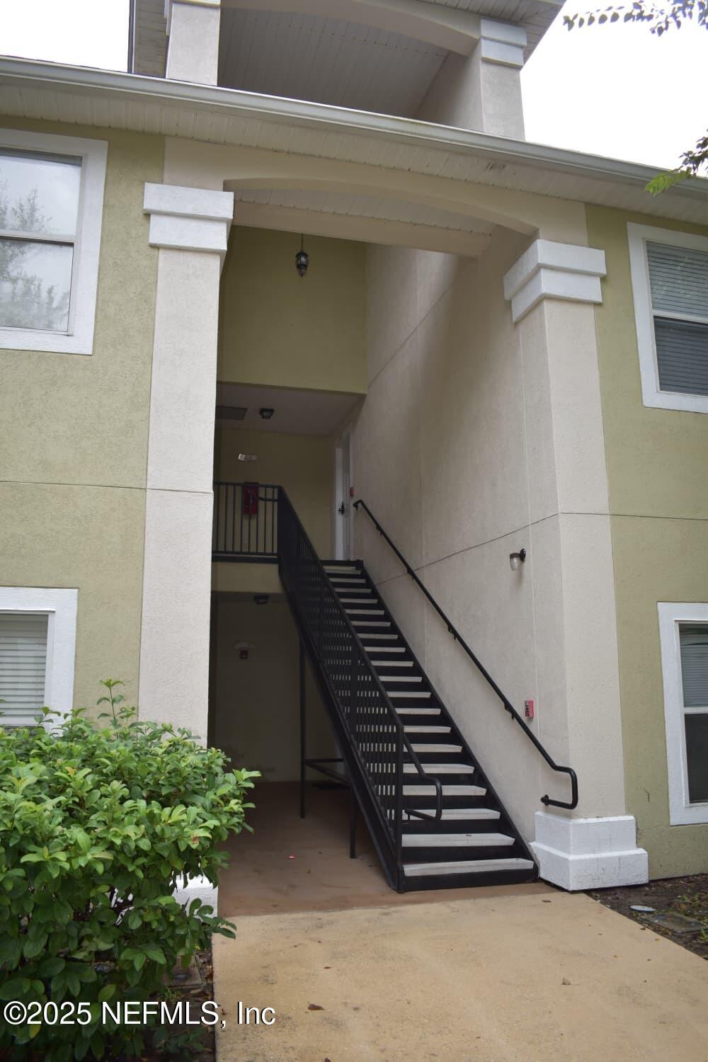 7920 Merrill Road, Unit 1710 Jacksonville, FL 32277 - Photo 3 of 51 a view of outdoor space with staircase
