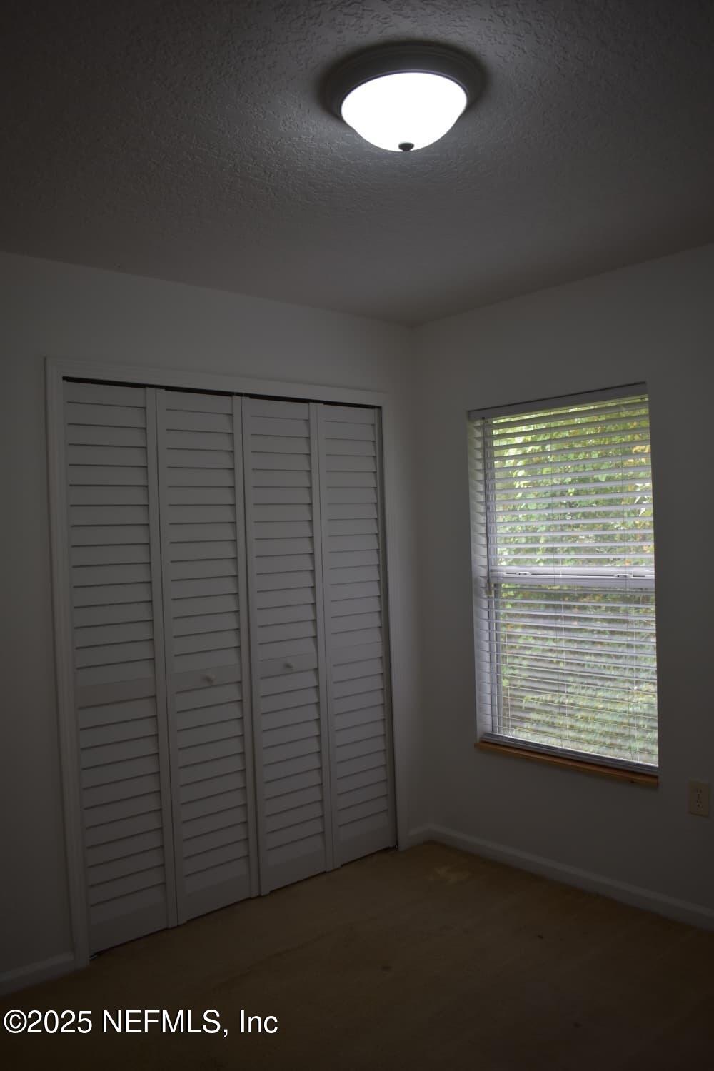 7920 Merrill Road, Unit 1710 Jacksonville, FL 32277 - Photo 32 of 51 a view of a small space with a window